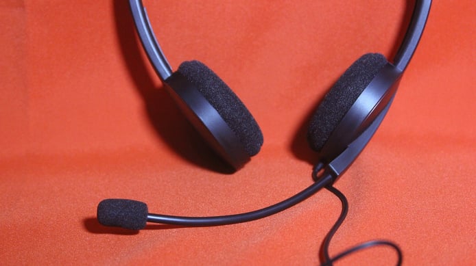 black-headset-on-a-red-table