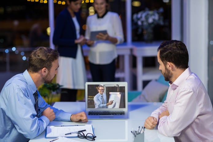Businessmen having video conference in conference room at office-1.jpeg