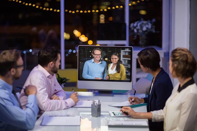 Business team having video conference in conference room at office.jpeg