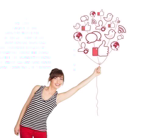 Happy young lady holding social icon balloon.jpeg