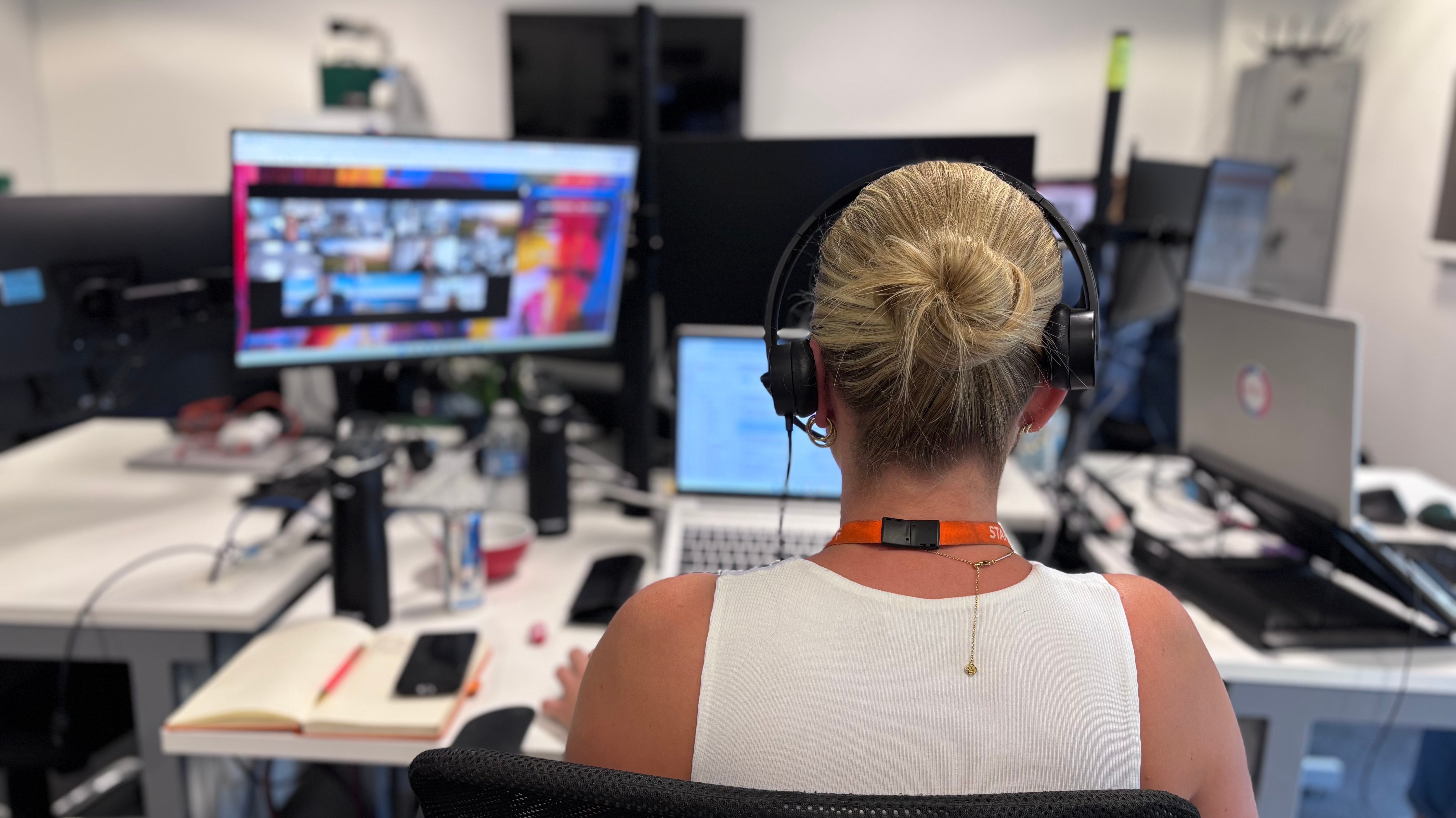 WorkCast team member wearing a headset while working on an online event