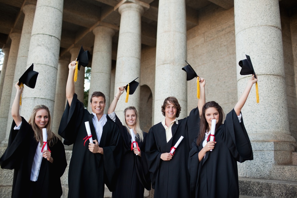 University graduates raising caps