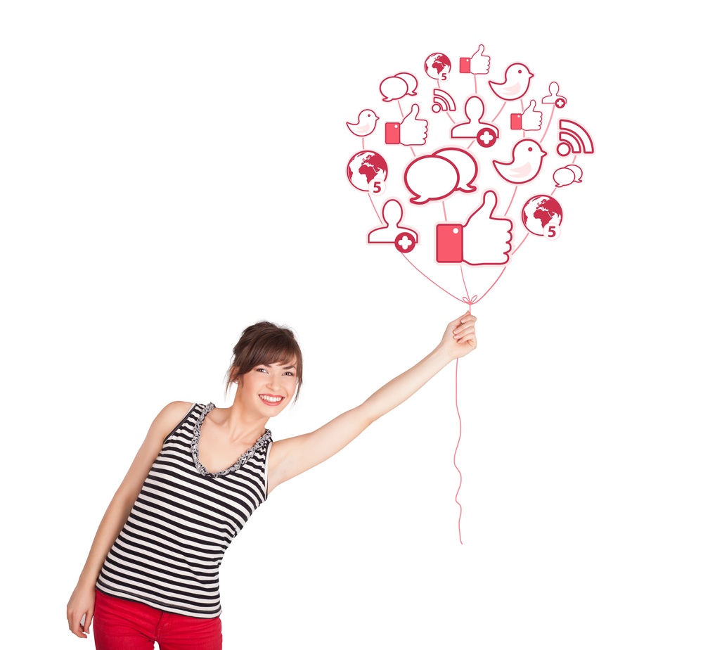 Happy person holding balloon of social media icons