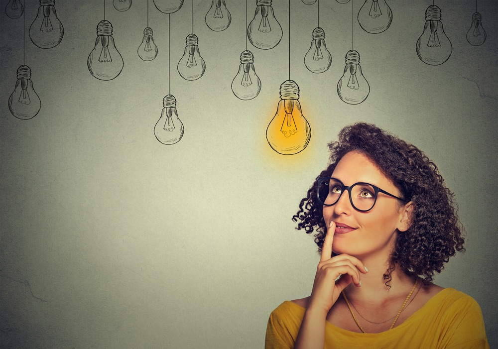 Woman thinking with lightbulbs above them