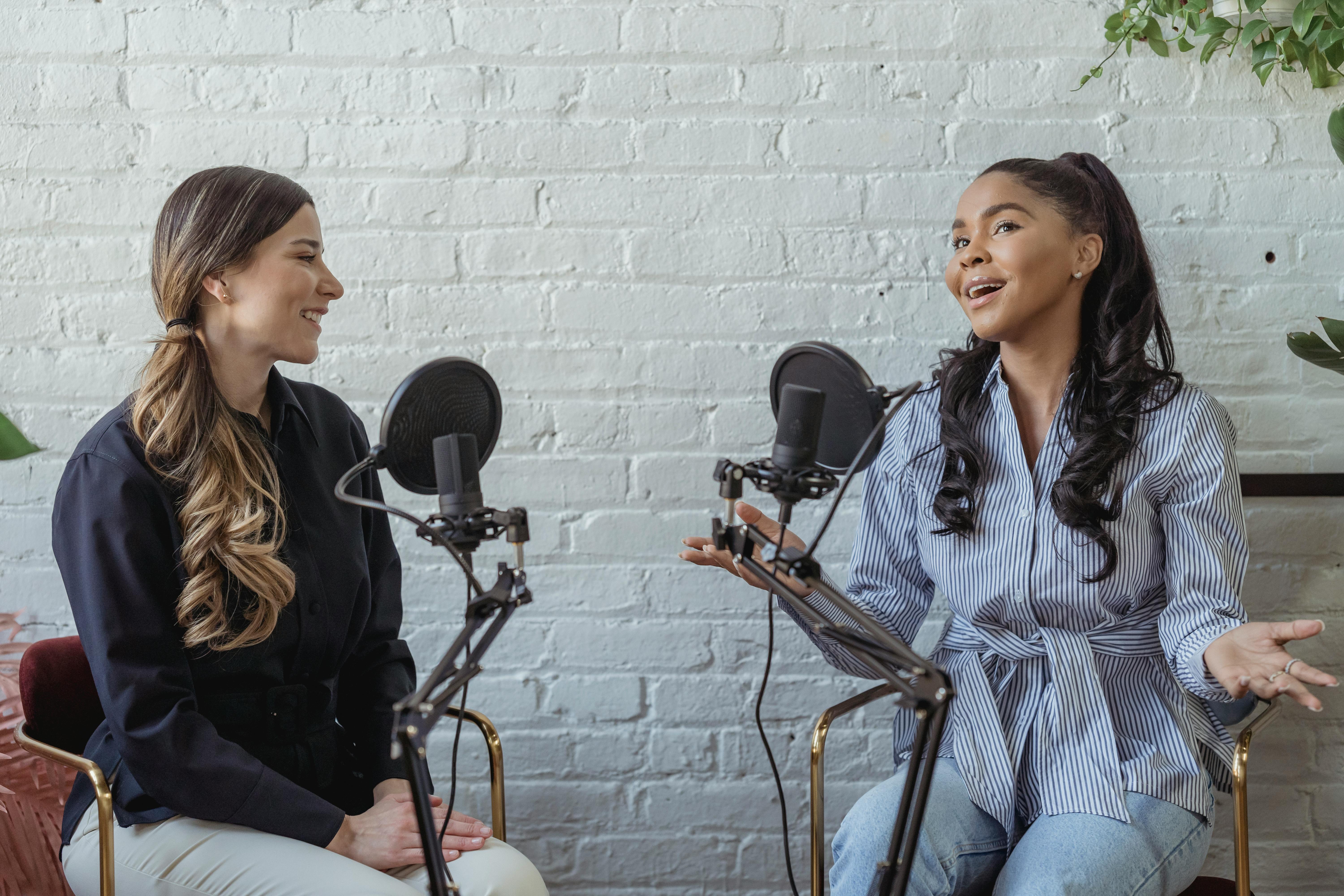 two people recording mics