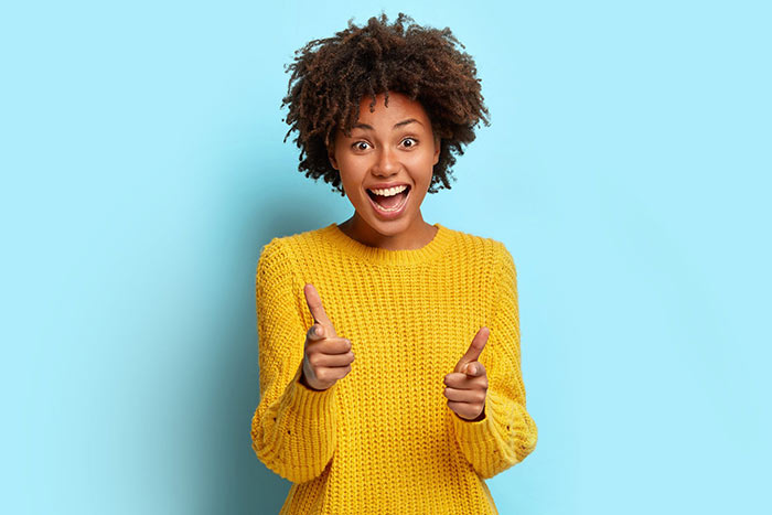 Happy person in yellow jumper